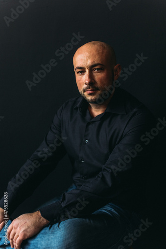 young man, business, speaker, businessman, studio portrait on black background.