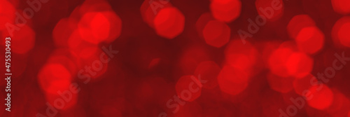 Red sparkling glitter bokeh background, christmas texture. Holiday lights. Abstract defocused header. Wide screen wallpaper. Panoramic web banner with copy space for design