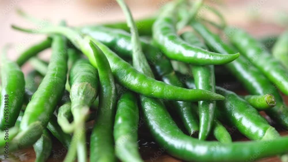 close up of green chili pepper on a chopping board close up of green chili pepper on a chopping board