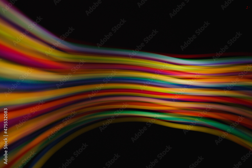 Colored lines of light on a black background. Colored lines of light on a black background.
