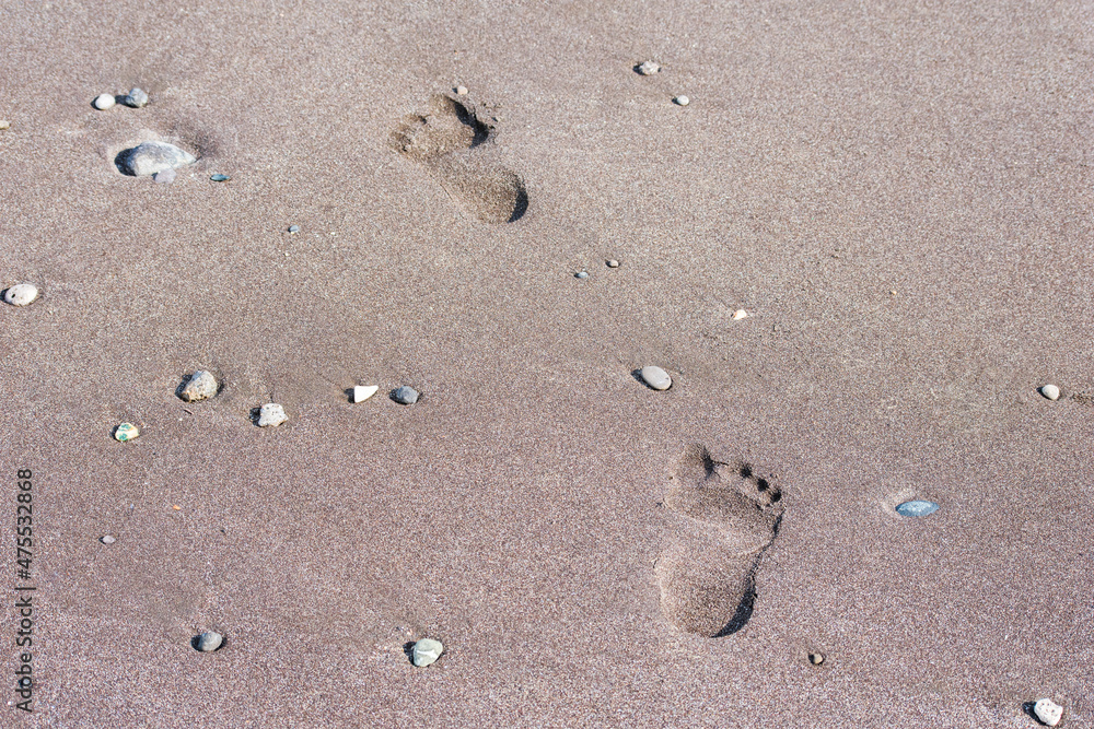 Footsteps on the beach at sea. footprint on sand at the beach background. Footsteps on the beach at sea. footprint on sand at the beach background.