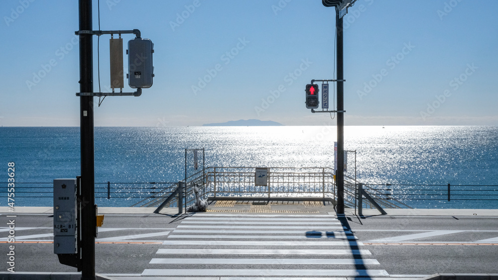 Traffic lamp by the seaside under the blue sky