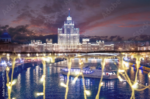 Moscow. Russia. Night lights of Christmas Moscow. The ship floats on the Moscow river. Motor ship in the winter river. The capital of Russia on a winter night. Traveling through the cities of Russia photo