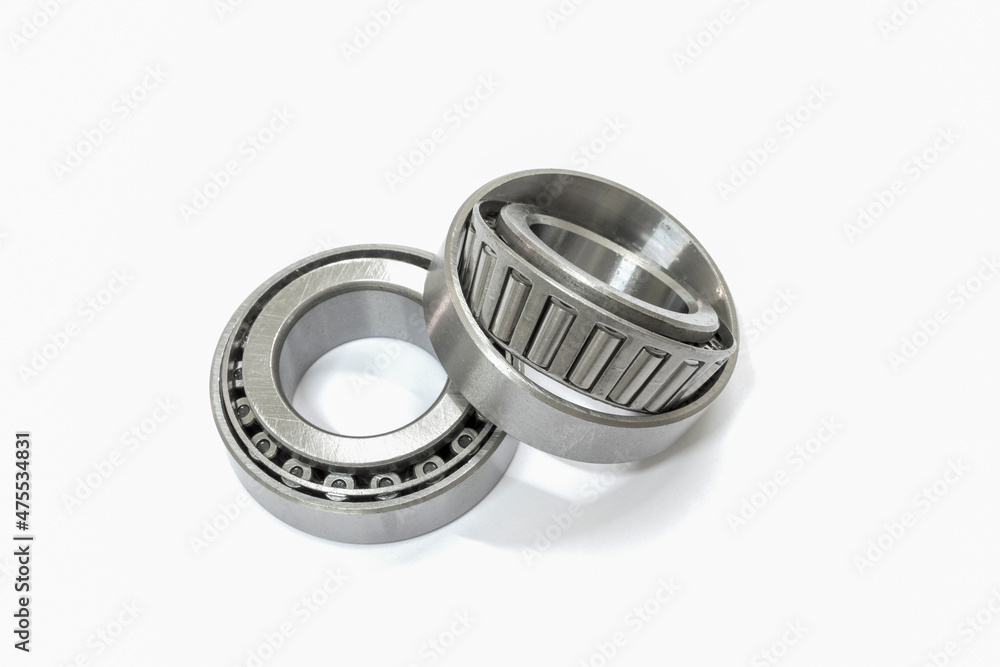Modify taper bearing on a white background, Motorcycle taper bearing close-up, Motorcycle modify. Modify taper bearing on a white background, Motorcycle taper bearing close-up, Motorcycle modify.