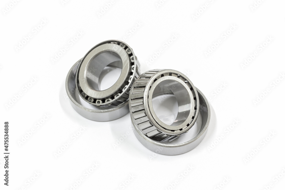 Modify taper bearing on a white background, Motorcycle taper bearing close-up, Motorcycle modify. Modify taper bearing on a white background, Motorcycle taper bearing close-up, Motorcycle modify.
