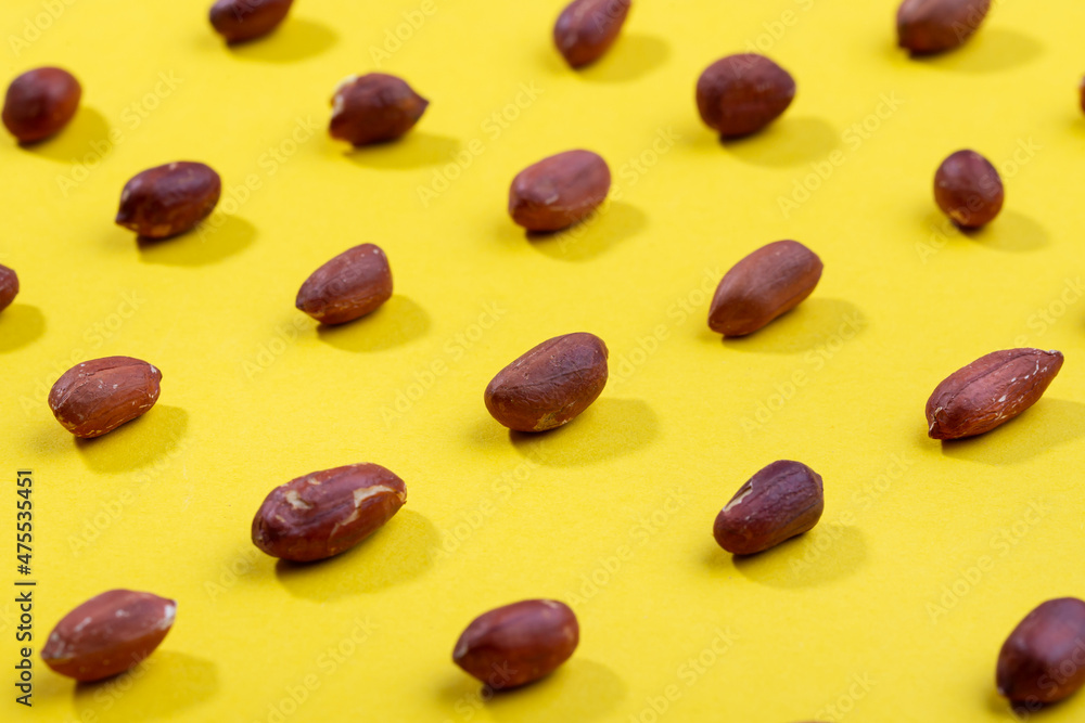 Pattern of peanuts. Fashionable sunny pattern of peanuts on yellow background. Pattern of peanuts. Fashionable sunny pattern of peanuts on yellow background.