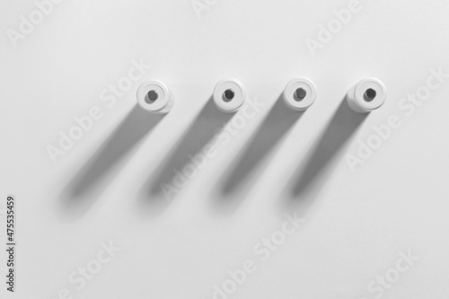 AA size alkaline batteries on a white background. Several batteries in a row. Space for text.