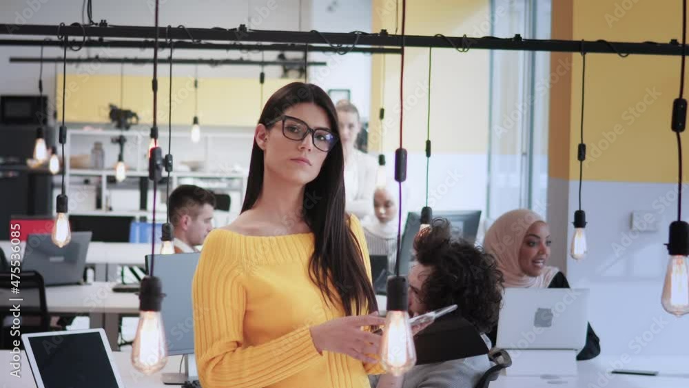 Modern business woman pose to camera in multicultural coworking business office Modern business woman pose to camera in multicultural coworking business office
