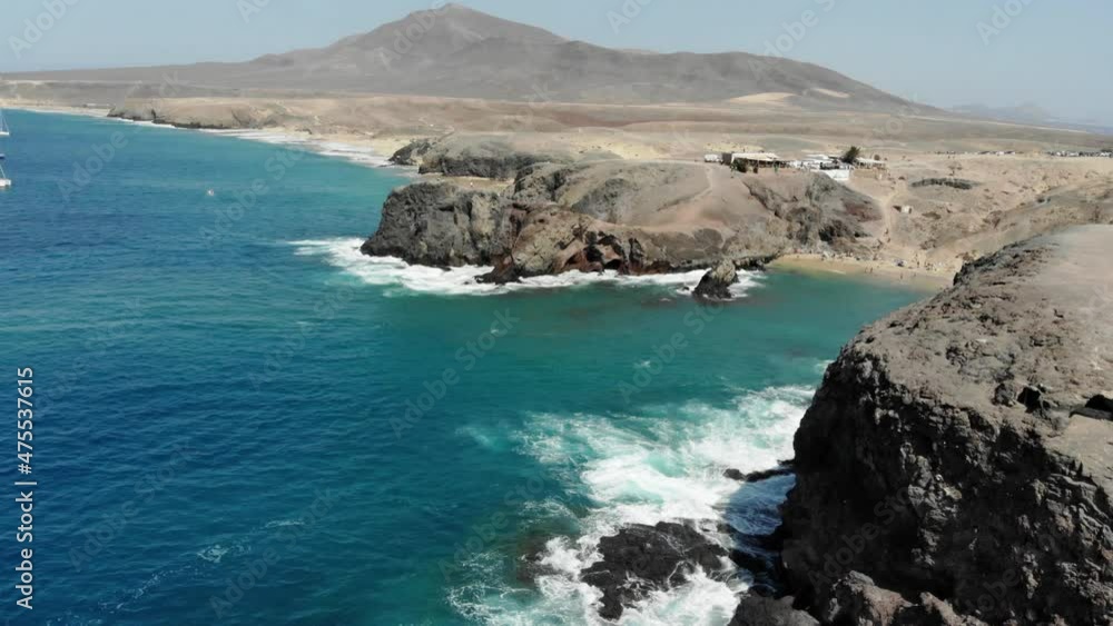 Playa de Papagayo Beach desert landscape and blue sky Lanzarote Drone shot 4k Playa de Papagayo Beach desert landscape and blue sky Lanzarote Drone shot 4k