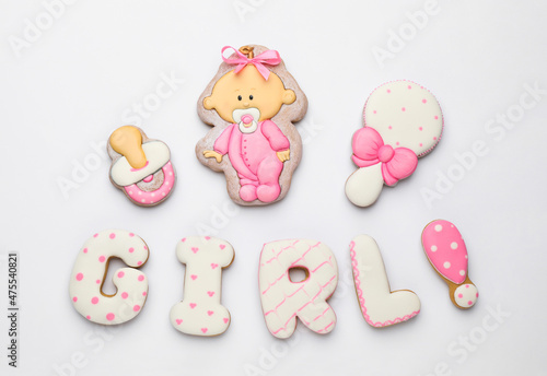 Word GIRL made of tasty cookies on white background, top view. Baby shower party