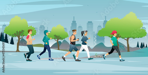 People who are women and men are jogging in the city park.