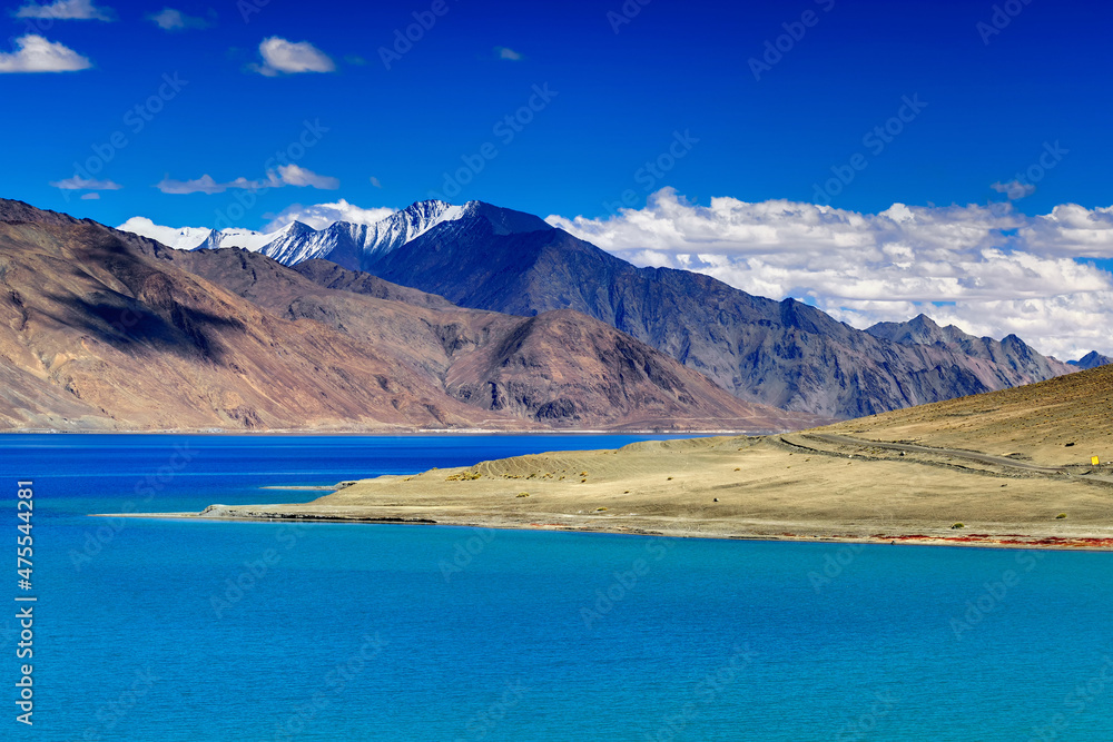 Blue water of Pangong tso (Lake). It is huge lake in Ladakh, shared by China and India along India China LOC border, Himalayan mountains alonside from India to Tibet.  Ladakh, Jammu and Kashmir, India
