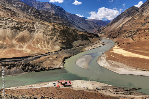 Scenic view of Confluence of Zanskar river from left and Indus rivers from up right - Leh, Ladakh, Jammu and Kashmir, India. This is a famous tourist spot of Ladakh for all seasons. landscape, scenic.