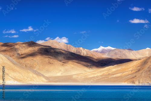 Mountains and Pangong tso (Lake). It is huge lake in Ladakh, shared by China and India along India China LOC border , long and extends from India to Tibet. Leh, Ladakh, Jammu and Kashmir, India