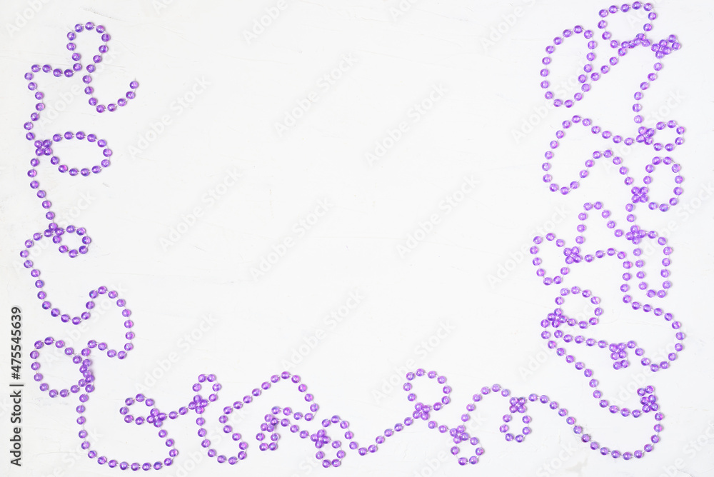 Christmas white background with frame of Christmas decorations beads. The place for the text can be used as a template. Christmas white background with frame of Christmas decorations beads. The place for the text can be used as a template.