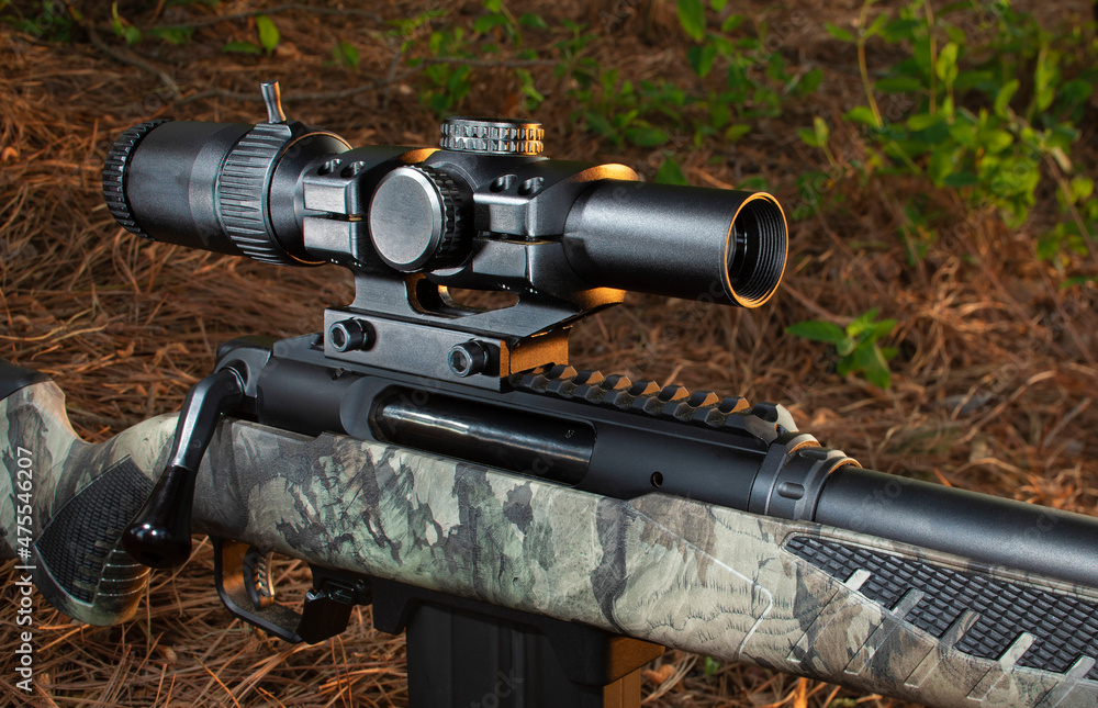 Scope on a hunting rifle at sunset Scope on a hunting rifle at sunset