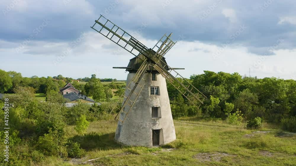 Aerial shot of an old windmill made of stone and wood Aerial shot of an old windmill made of stone and wood