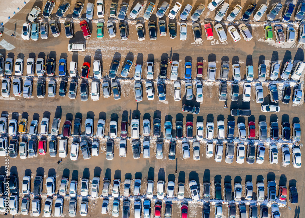 Top view of the car park during the snowmelt in spring