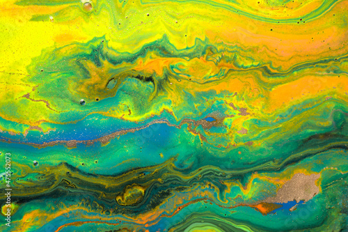 Abstract fluorescent ink mix with gold dust.