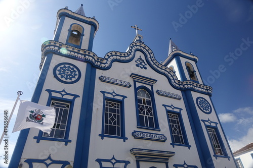 Shiny white and blue Igreja do Senhor Santo Cristo (Church of the Holy Christ) against the blue summer sky, Praia da Vitória, Terceira, Azores, Portugal
