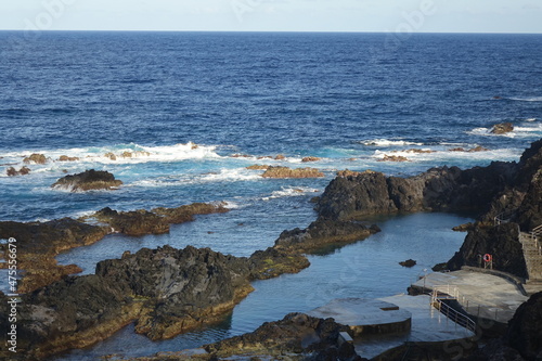 Piscinas naturais de Santa Cruz das Flores tidal pool in the volcanic cliffs on a sunny summer day, Santa Cruz das Flores, Flores, Azores, Portugal