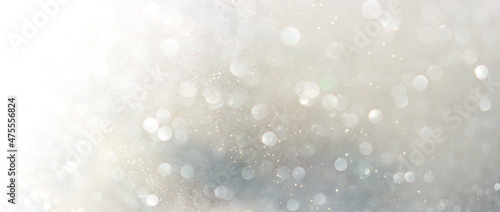 background of abstract gold and silver glitter lights. defocused