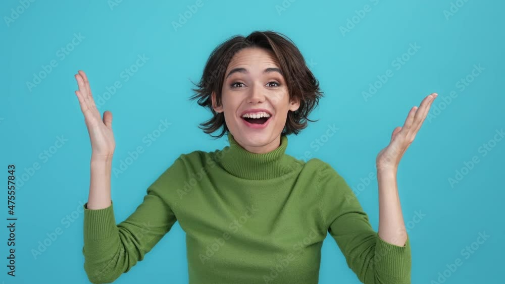 Energetic lady impressed fist up scream isolated blue color background Energetic lady impressed fist up scream isolated blue color background