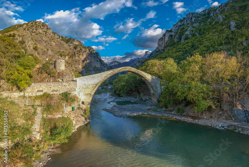 The famous old stoned bridge of Konitsa over Aoos river. Tymfi mount, Zagori, Epirus, Greece, Europe