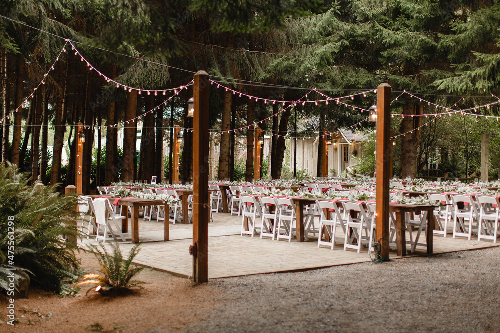 Wedding arch in the woods with light bulbs Beautiful rustic wedding in the  forest String Lights