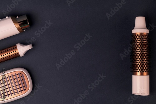 Fotografie Layout of Hairdresser tools on dark background.