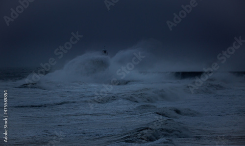 Photo The gale force winds from Storm Arwen cause giant waves to batter the lighthouse