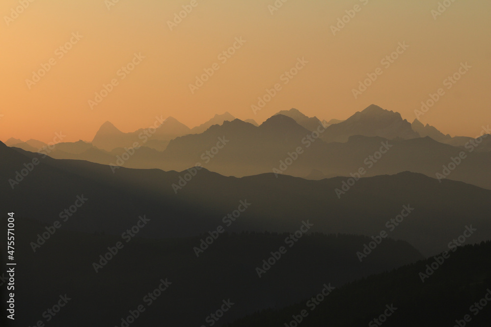 Sunrise view from a place near Gstaad, Switzerland. Mountain ranges in the Bernese Oberland.