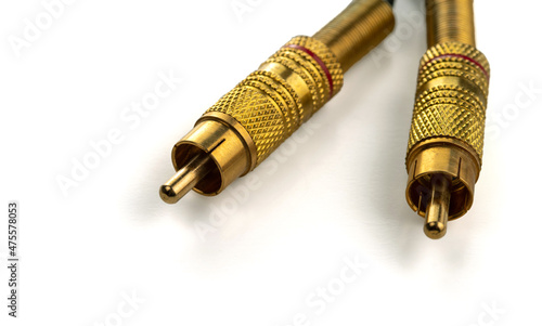 Two RCA connectors with a gold covering for audio and video. Isolated on white background. photo