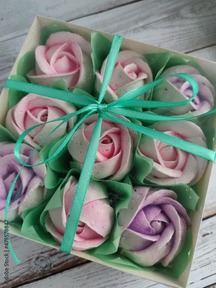 sweet roses in a holiday box. Festive dessert. sweet roses in a holiday box. Festive dessert.