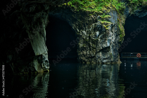 cave with water and colorful landscape