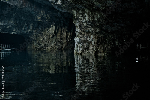 picturesque cave with water in summer