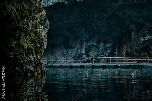 picturesque cave with water in summer