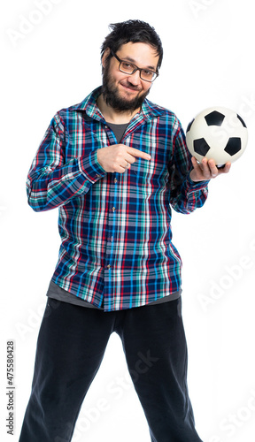 A bearded man in a plaid shirt holds the ball and on it.