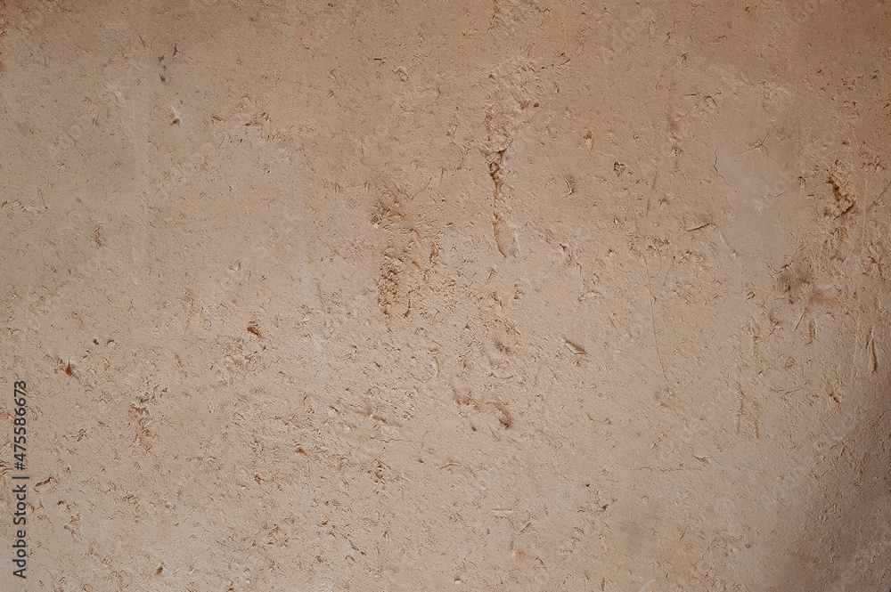 An ancient method of plastering with clay. Old clay wall. Last century. Old plaster background. An ancient method of plastering with clay. Old clay wall. Last century. Old plaster background.