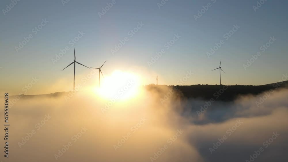 Wind farm in the fog at sunrise. Aerial photography Wind farm in the fog at sunrise. Aerial photography