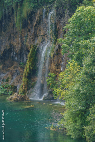 Majestic view on waterfall with turquoise water in the Plitvice Lakes National Park, Croatia