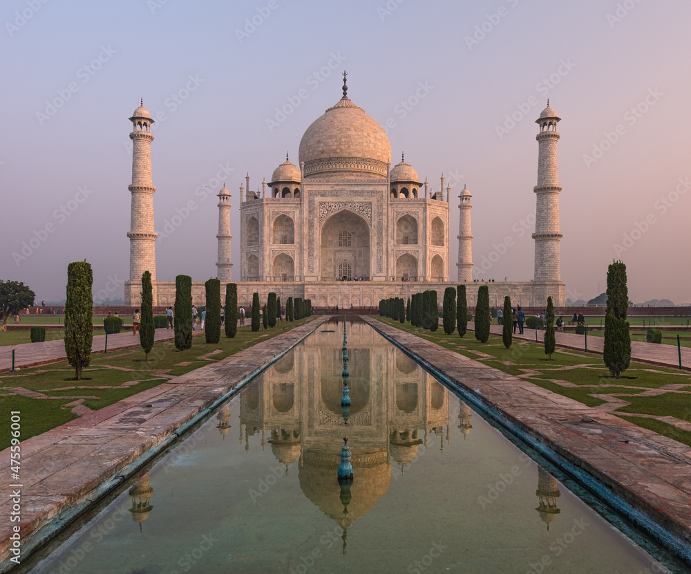 Obraz premium The Taj Mahal Mausoleum in Agra, India, seen from the other bank of the river, near the Garden of the Moon, at sunrise