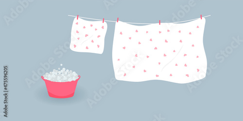 Concept of washing and drying: washed cute white bed sheet and pillowcase with pink hearts.Linen hanging on clothesline and it is attached by clothespins.Wash basin with soap foam. Vector