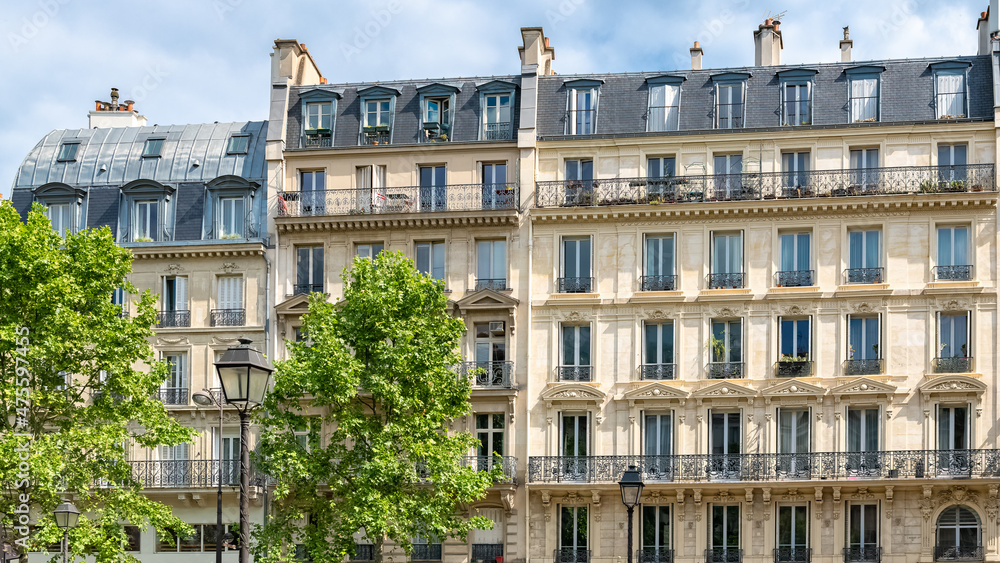 Paris, typical facades and street, beautiful buildings rue du Temple
