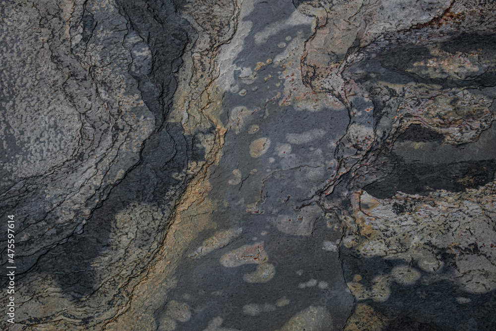 Dark grey sand stone textured abstract backdrop