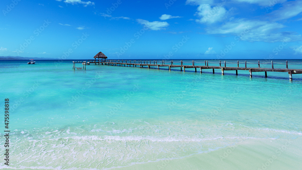 Wooden pier on dominican lagoon. Copy space, wide angel