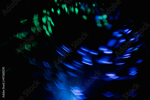 abstract blue on black bokeh background overlay layer. sparks and blowing. festive background. Sparkling magical dust particles.