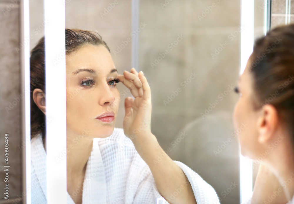 Magic anti-aging cream.Applying the cream. Magic anti-aging cream.Applying the cream.