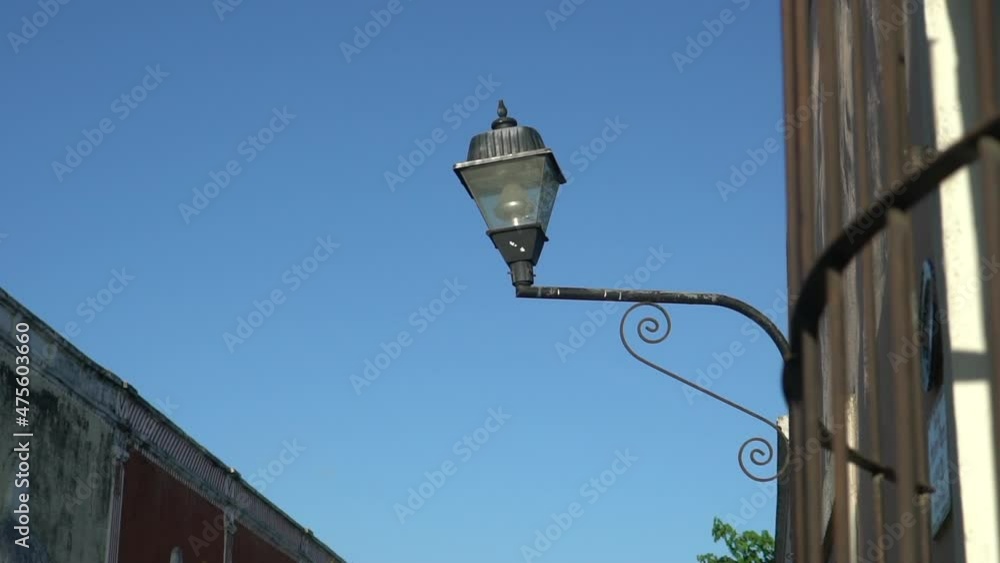 Old Fashioned Street Light On The Red Wall In The Historic Valladolid center. High quality FullHD footage
