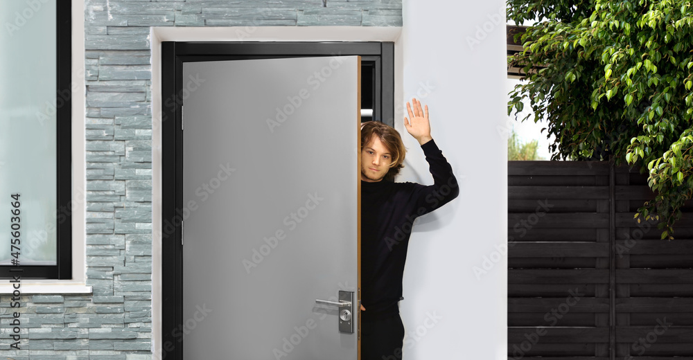 man opening the door .Inviting the guests